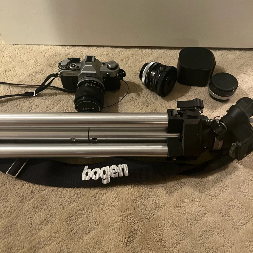 Canon camera, two 50mm lenses and tripod all included. it’s been well stored